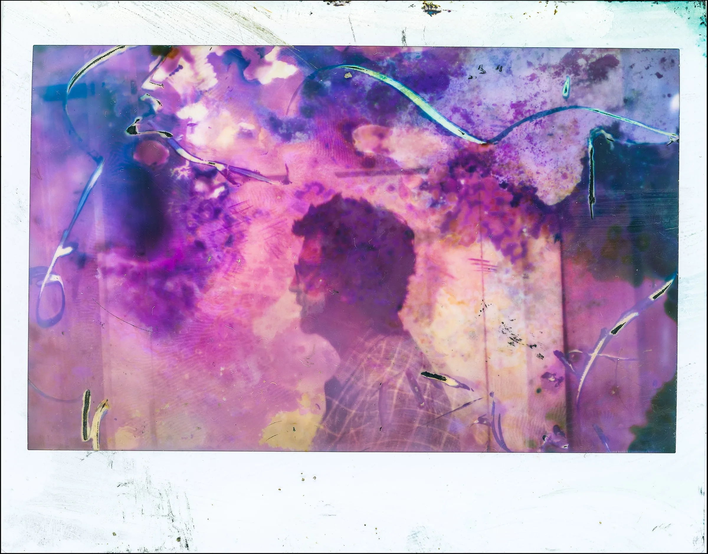 Emulsion-lift Polaroid dissolving a silhouette into violet chemistry