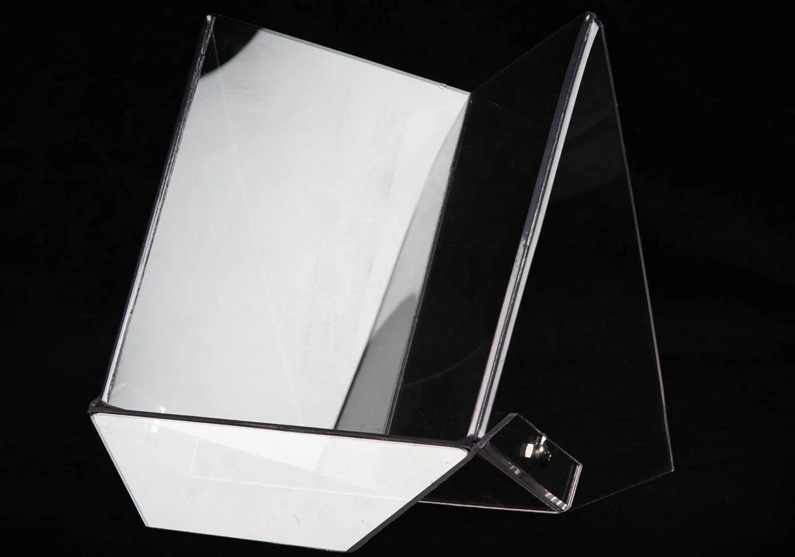 Mirrored acrylic display easel photographed on black