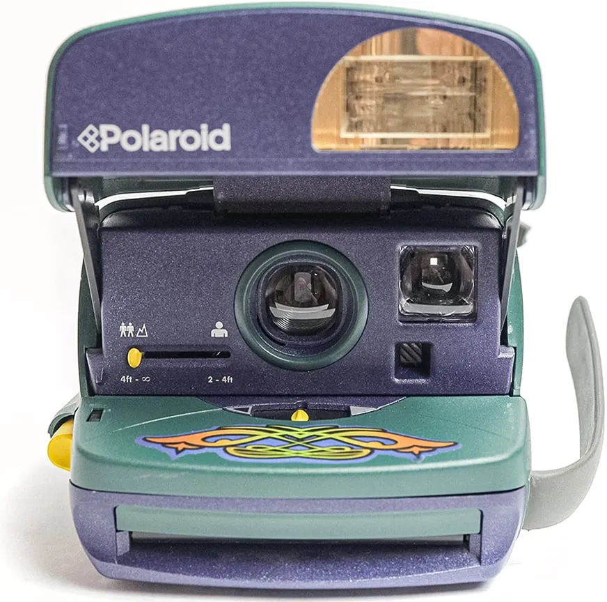 Green and purple Polaroid 600 camera, front view on white